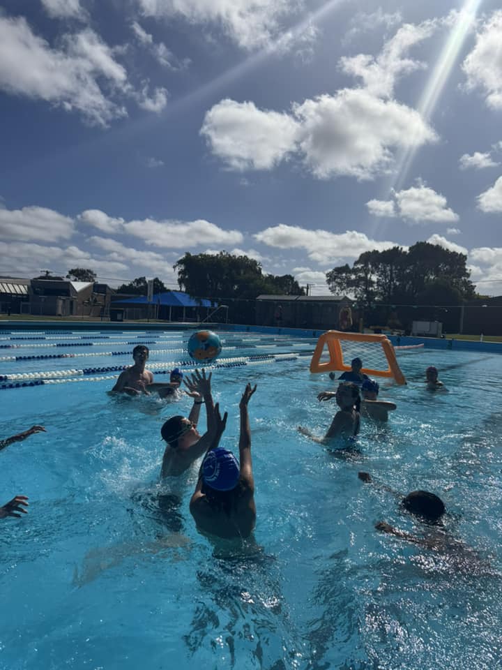 Kids enjoying a game of water polo